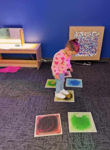 Child enjoying a sensory learning activity